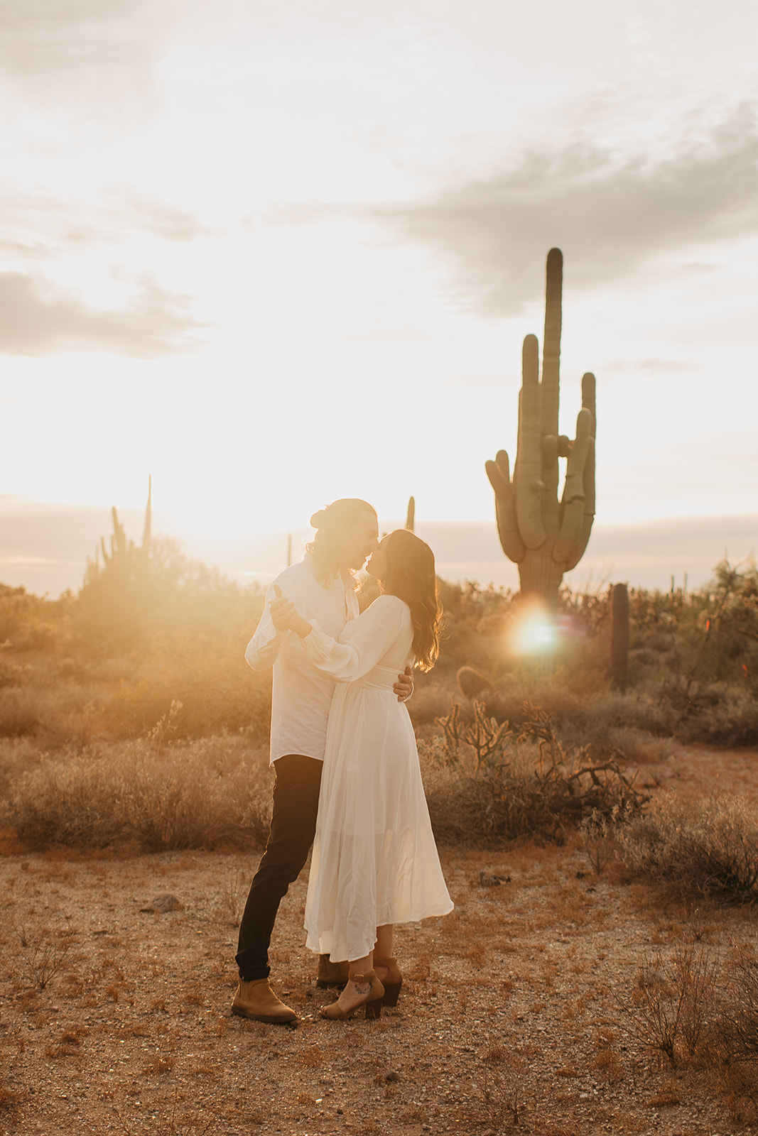 couples dancing in the desert sunset